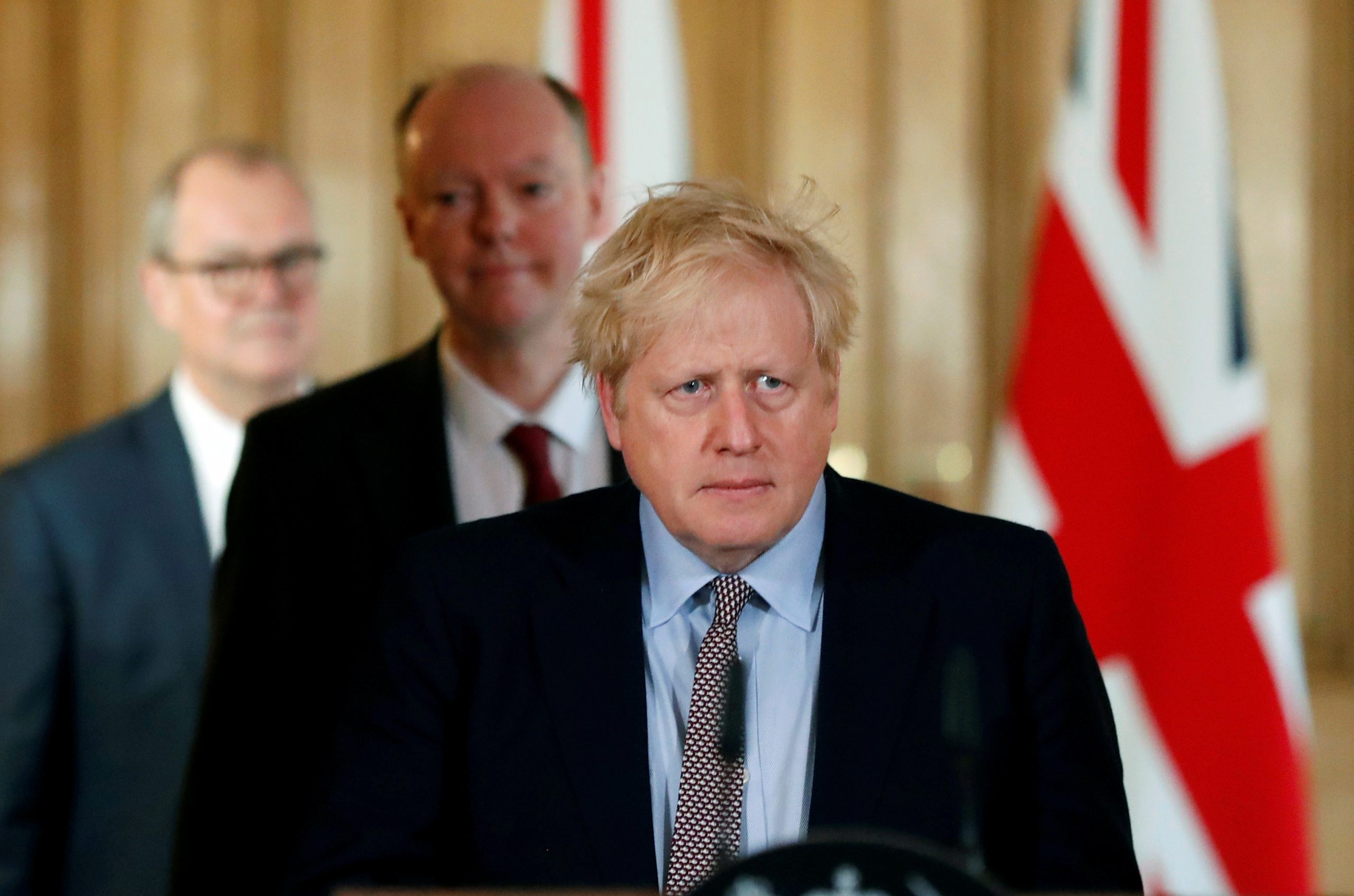 FILE PHOTO: Britain's Prime Minister Boris Johnson attends a news conference on the novel coronavirus, in London FILE PHOTO: Britain's Prime Minister Boris Johnson, Chris Whitty, Chief Medical Officer for England and Chief Scientific Adviser to the Government, Sir Patrick Vallance, arrive for a news conference on the novel coronavirus, in London, Britain March 3, 2020.   To match Special Report HEALTH-CORONAVIRUS/BRITAIN-PATH  Frank Augstein/Pool via REUTERS/File Photo POOL New