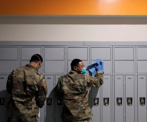 Members of Joint Task Force 2, composed of soldiers and airmen from the New York Army and Air National Guard, work to sanitize the New Rochelle High School during the coronavirus disease (COVID-19) outbreak in New Rochelle, New York Members of Joint Task Force 2, composed of soldiers and airmen from the New York Army and Air National Guard, work to sanitize the New Rochelle High School during the coronavirus disease (COVID-19) outbreak in New Rochelle, New York, U.S., March 21, 2020. REUTERS/Andrew Kelly ANDREW KELLY