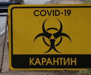 epa08398933 A sign reading 'COVID-19 Quarantine' at the road at the entrance to the Pervomayskoe settlement amid the ongoing coronavirus COVID-19 pandemic in Leningrad region, Russia, 03 May 2020. Russian President Vladimir Putin extended a home quarantine to 11 May 2020 to prevent the spread of the SARS-CoV-2 coronavirus which causes the COVID-19 disease.  EPA/ANATOLY MALTSEV
