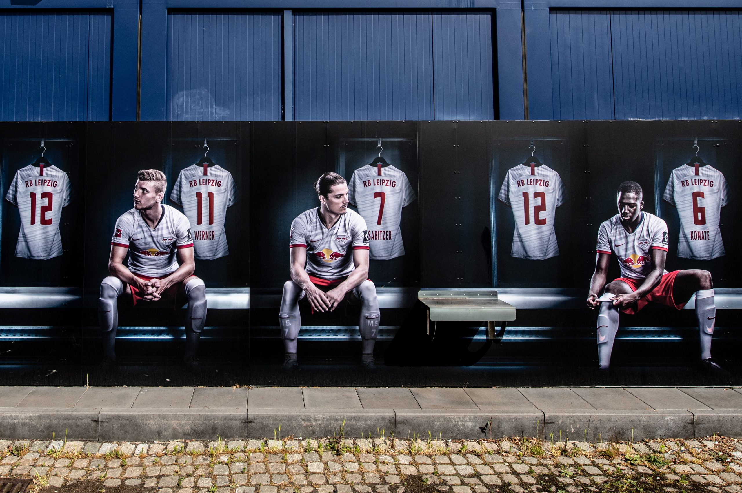 epa08402268 Painting shows German Bundesliga RB Leipzig  players (L-R) Timo Werner, Marcel Sabitzer and Ibrahima Konate on wall of club's  fanshop in Leipzig, Germany, 05 May 2020. The German Football Association (DFL) has presented a comprehensive concept for the resumption of play amid the ongoing coronavirus COVID-19 pandemic. In order to slow down the spread of the COVID-19 disease caused by the SARS-CoV-2 coronavirus, the Bundesliga has been on a break since 13 March 2020.  EPA/FILIP SINGER