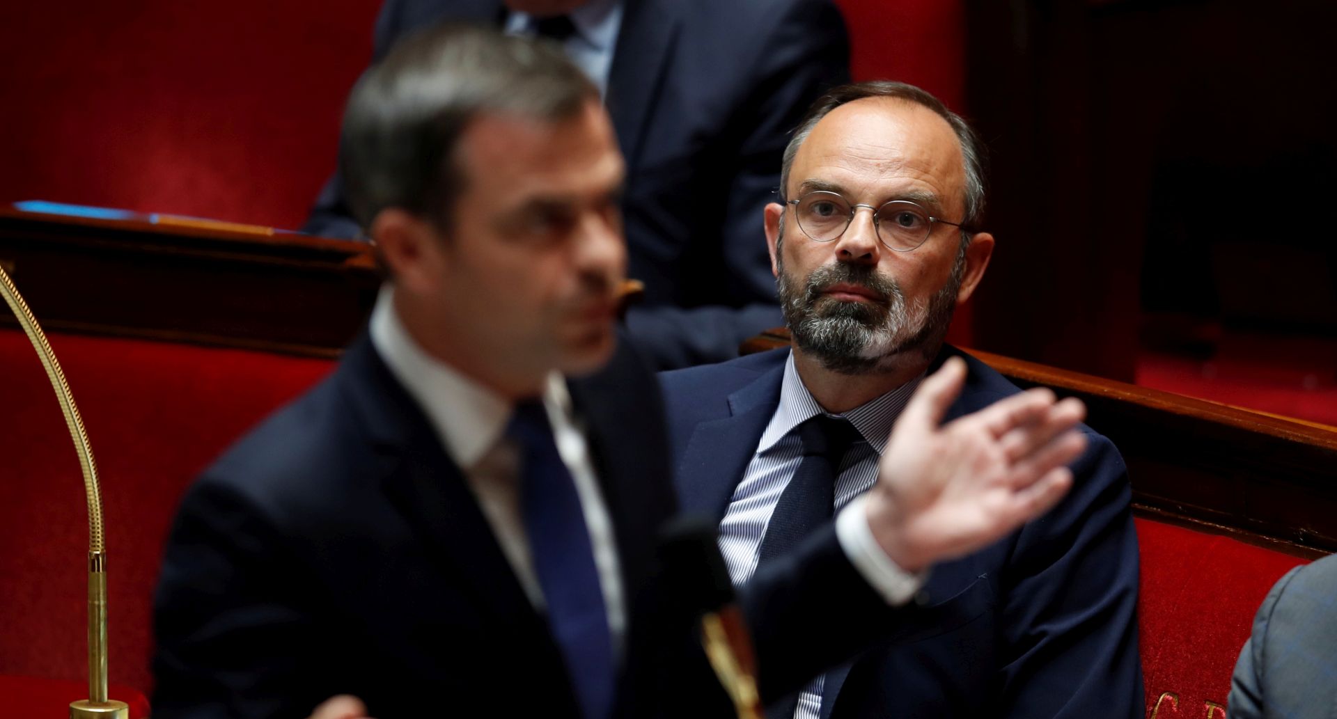 epa08416985 French Prime Minister Edouard Philippe (R) listens to the speech of French Health and Solidarity Minister Olivier during the questions to the government session at the National Assembly as France softens its strict lockdown rules during the outbreak of the coronavirus disease (COVID-19) in Paris, France, 12 May 2020.  EPA/GONZALO FUENTES / POOL  MAXPPP OUT