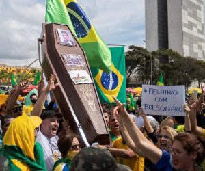 epaselect epa08428665 Supporters of Brazilian President Jair Bolsonaro attend a rally to show their support at Esplanada dos Ministerios, in Brasilia, Brasil, 17 May 2020. The coffin depicts ex-Minister of Justice Sergio Moro who accused Bolsonaro of interfering in the actions of the Federal Police.  EPA/Joédson Alves