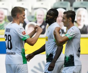 31 May 2020, North Rhine-Westphalia, Moenchengladbach: Borussia Moenchengladbach's Florian Neuhaus (R) celebrates scoring his side's first goal with teammates Matthias Ginter (L) and Marcus Thuram during the German Bundesliga soccer match between Borussia Moenchengladbach and Union Berlin at Borussia-Park. Photo: Martin Meissner/AP Pool/dpa - IMPORTANT NOTICE: DFL and DFB regulations prohibit any use of photographs as image sequences and/or quasi-video.