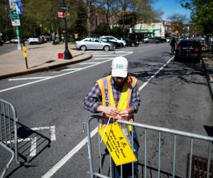 The spread of the coronavirus disease (COVID-19) in New York A worker places information as he closes a street to be used by pedestrians for ensuring that social distancing norms are maintained, during the outbreak of the coronavirus disease (COVID-19) in the Manhattan borough of New York City, U.S., May 2, 2020. REUTERS/Eduardo Munoz EDUARDO MUNOZ