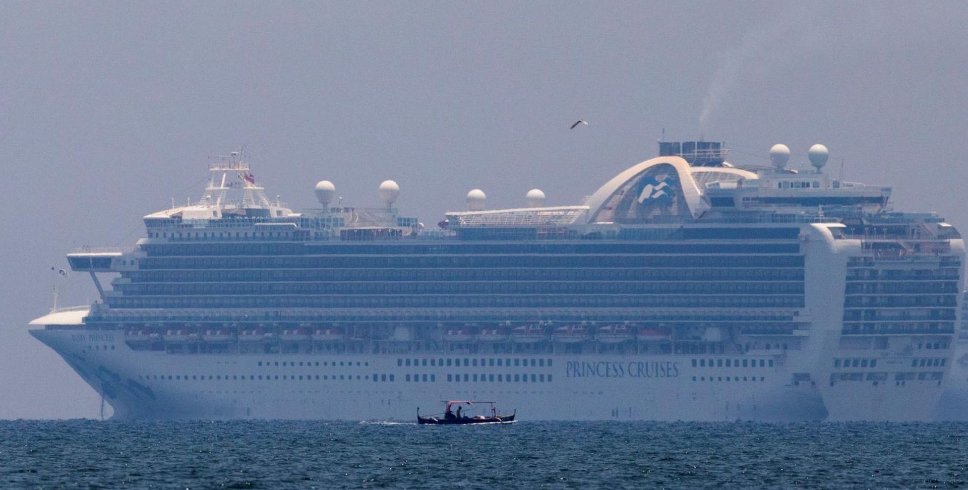 Princess Cruises' Ruby Princess cruise ship docks in Manila Bay A fishing boat sails past the Princess Cruises' Ruby Princess cruise ship as it docks in Manila Bay during the coronavirus disease (COVID-19) outbreak, in Cavite City, Philippines, May 7, 2020. REUTERS/Eloisa Lopez ELOISA LOPEZ