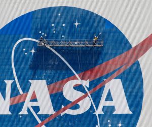 Workers pressure wash the logo of NASA on the Vehicle Assembly Building, in Cape Canaveral Workers pressure wash the logo of NASA on the Vehicle Assembly Building before SpaceX will send two NASA astronauts to the International Space Station aboard its Falcon 9 rocket, at the Kennedy Space Center in Cape Canaveral, Florida, U.S., May 19, 2020. REUTERS/Joe Skipper JOE SKIPPER