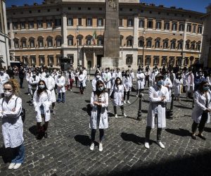 epaselect epa08446923 Medical students, graduate students and young doctors protest in front of the Italian Parliament during the second phase of the coronavirus disease (COVID-19) pandemic, emergency in Rome, Italy, 27 May 2020. According to media reports, demonstrators denounced the fragility of the national health system.  EPA/ANGELO CARCONI