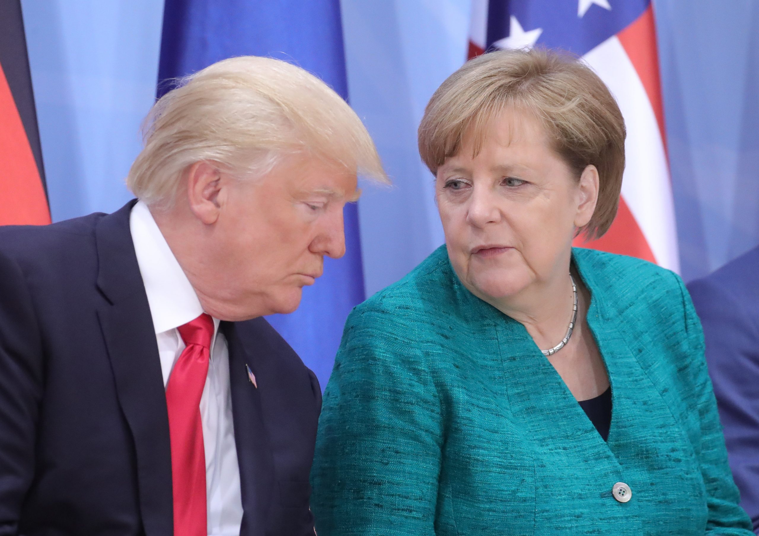 FILED - 08 July 2017, Hamburg: US President Donald Trump (L), speaks with German Chancellor Angela Merkel during a panel discussion at the G20 summit. German Chancellor Angela Merkel has declined an invitation from US President Donald Trump to the upcoming G7 summit "given the overall pandemic situation," a government spokesman said Saturday. Photo: Michael Kappeler/dpa-Pool/dpa