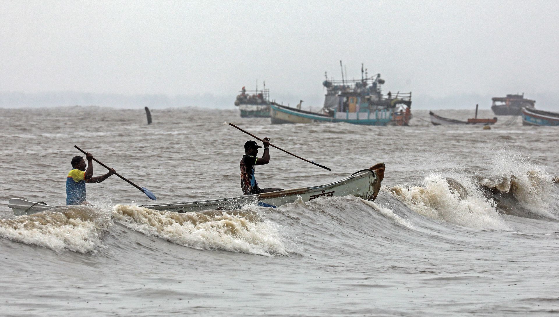 epa08462061 Indian fishermen arrives at the Arabian sea shore, at the Uttan village, near Mumbai, India, 03 June 2020. The India Meteorological Department (IMD) has advised fishermen not to venture out to sea along the coast of Maharashtra as a precaution against approaching tropical cyclone Nisarga. The cyclone Nisarga will landfall in Mumbai on 03 June 2020.  EPA/DIVYAKANT SOLANKI