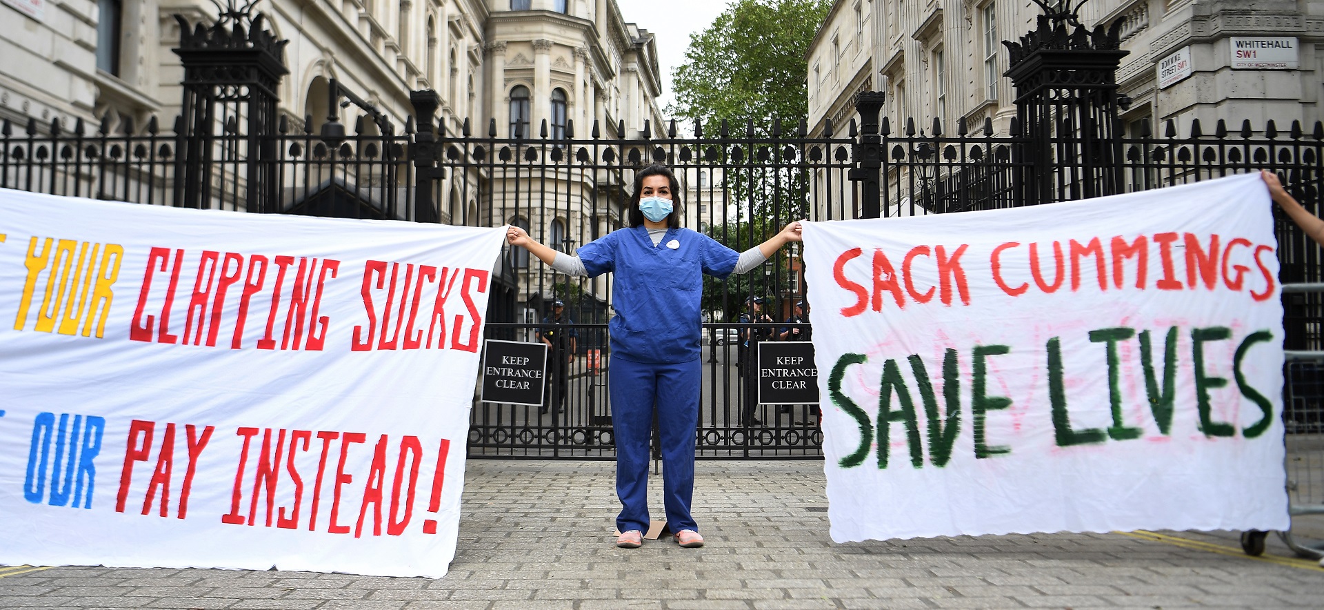 epa08462478 Nurses protests against the lockdown breach of Special Advisor Dominic Cummings outside 10 Downing Street in London, Britain, 03 June, 2020. Cummings broke lockdown regulations in April but has been backed by Prime Minister Boris Johnson. Calls for Cummings's resignation have increased since news broke the Cummings violated lockdown regulations when he and his wife - both suspected of showing Covid-19 symptoms - travelled across the country to self-isolate at a family's property.  EPA/ANDY RAIN