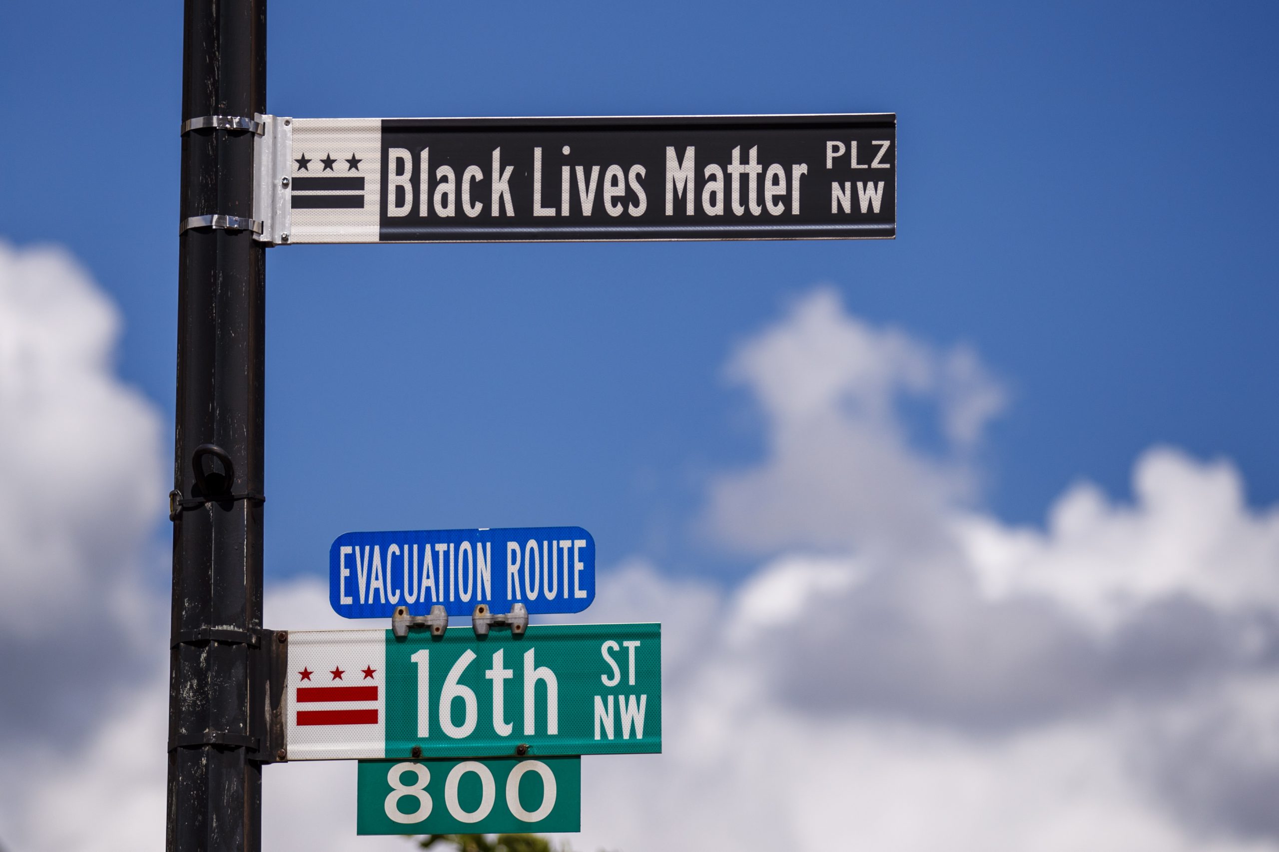 epa08467776 New street signs read Black Lives Matter on 16th Street near the White House, where there have been of seven days of protests over the death of George Floyd, who died in police custody, in Washington, DC, USA, 05 June 2020. Earlier in the day DC Mayor Muriel Bowser renamed that section of 16th Street Black Lives Matter Plaza.  EPA/SHAWN THEW
