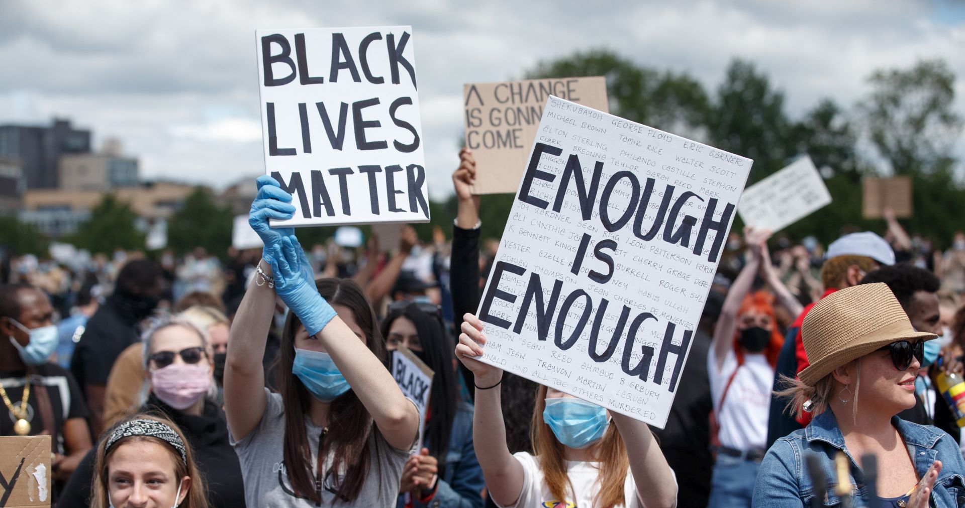 epa08471438 Protesters hold placards during a 'Black Lives Matter' (BLM) demonstration at Glasgow Green, Glasgow, Britain, 07 June 2020. Thousands of people defy the coronavirus lockdown order to take part in the anti-racism demonstration held to condemn the killing of George Floyd, a 46-year-old African-American man who died on 25 May after being detained by police officers in Minneapolis (Minnesota), USA, and to express solidarity with the BLM-led protests currently taking place throughout the US.  EPA/ROBERT PERRY