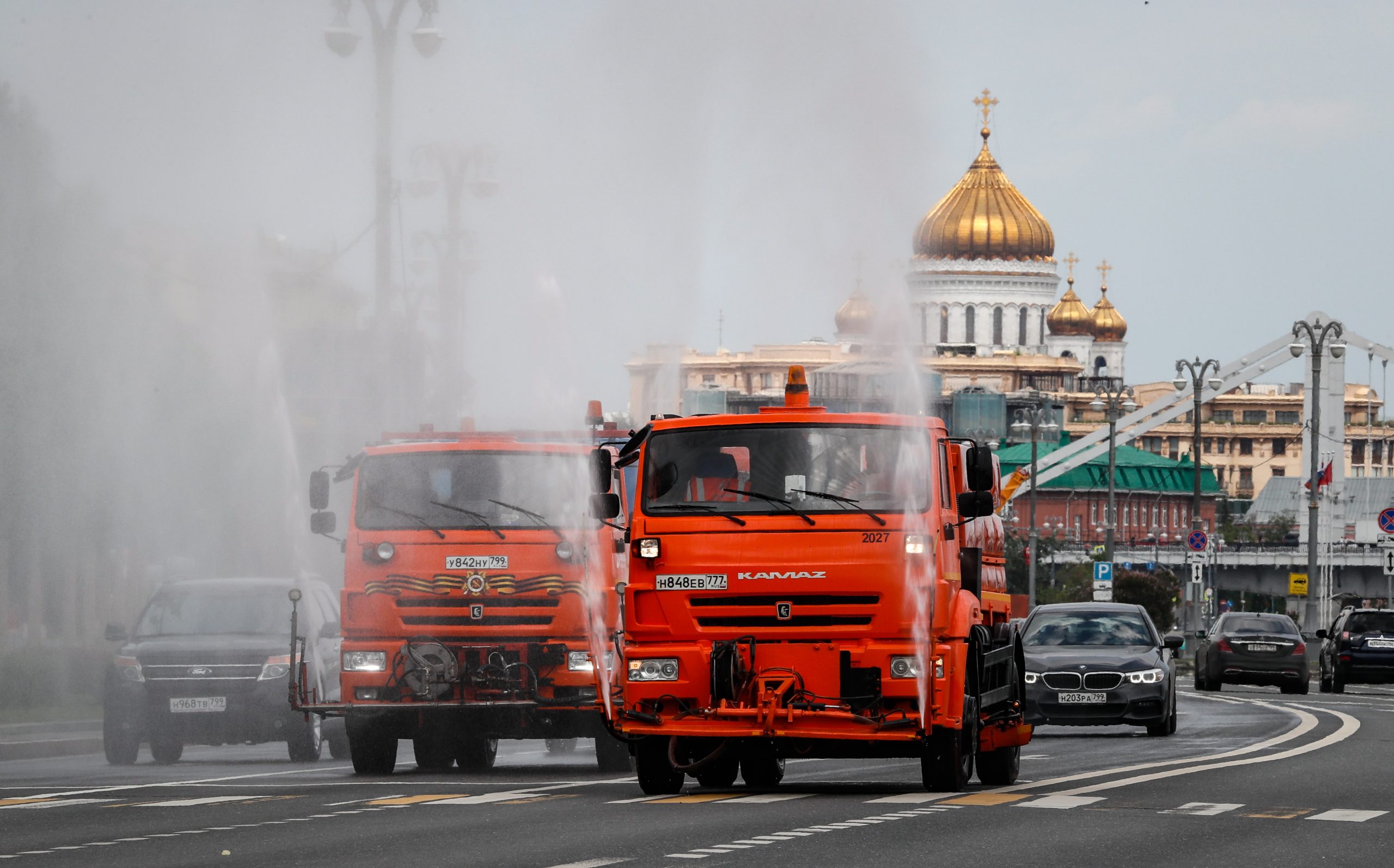 epa08477085 Municipal watering trucks spray disinfectant liquid on an avenue during the lockdown to combat the spread of the SARS-CoV-2 coronavirus which causes the COVID-19 disease in Moscow, Russia, 10 June 2020. Moscow authorities will cancel self-isolation regime from 09 June 2020. All residents of the city, including people over 65 and with chronic illnesses, will be able to go out and travel without restrictions.The requirement to wear masks and gloves in public places will continue.  EPA/YURI KOCHETKOV