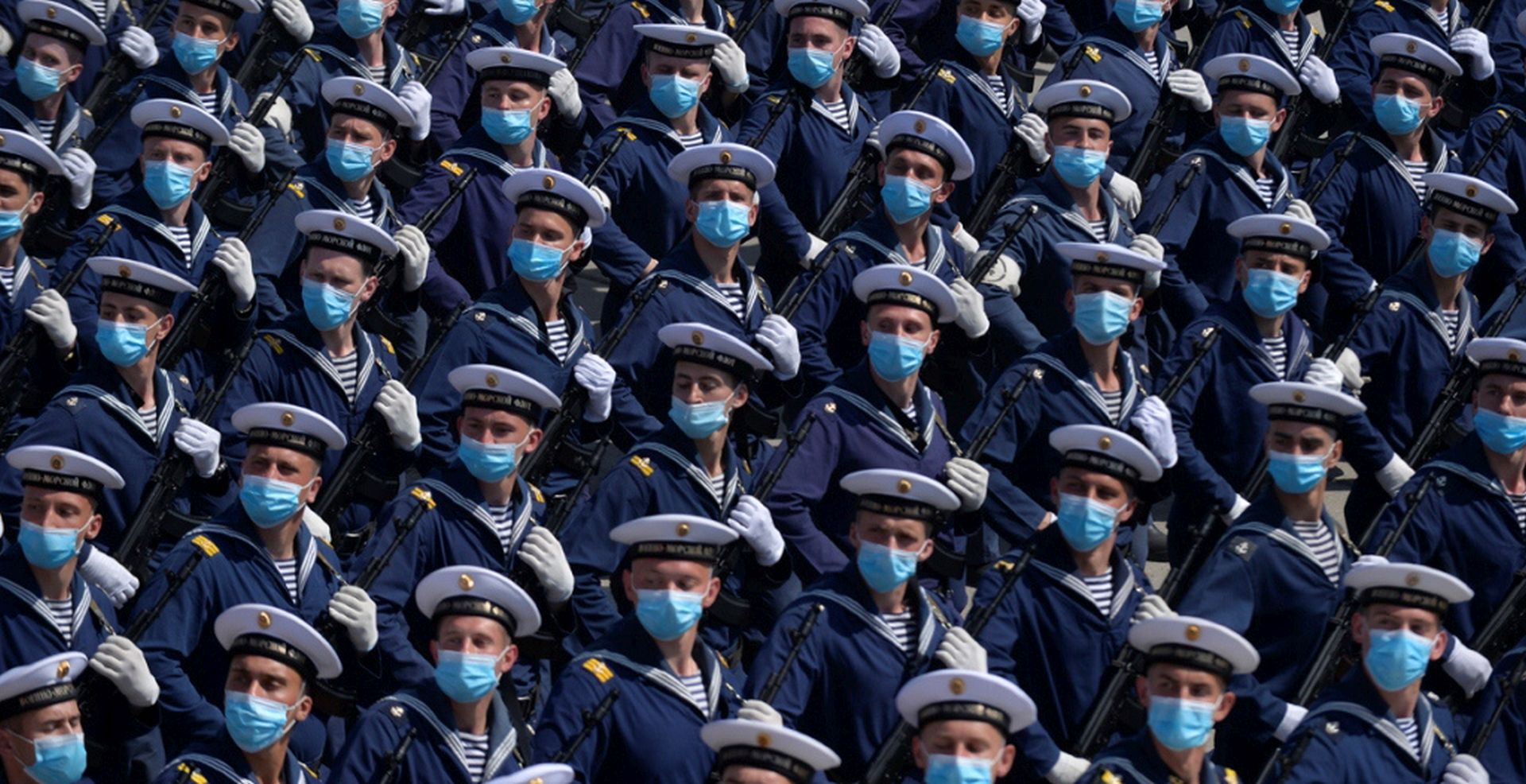 epaselect epa08477937 A handout photo made available by the Russian Defence Ministry shows Russian military servicemen wearing protective face masks as they march during a rehearsal of a military parade in Alabino outside Moscow, Russia, 10 June 2020. The military parade marking the 75th anniversary of the victory over Nazi Germany in the World War II will take place on the Red Square on 24 June 2020. The traditional troops parade as part of the Victory Day Parade which is annually held on 09 May, was cancelled due to Covid-19 epidemic in Russia.  EPA/RUSSIAN DEFENCE MINISTRY / HANDOUT  HANDOUT EDITORIAL USE ONLY/NO SALES
