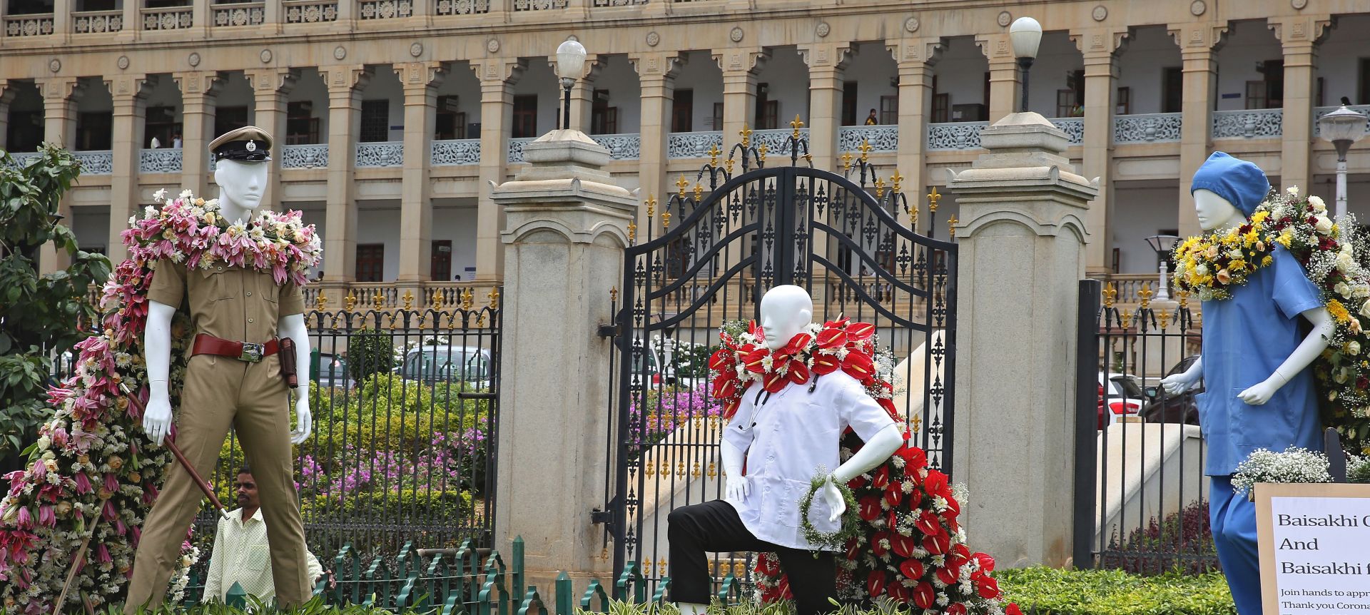 epa08478844 Statues of a police officer, a doctor, and nurse, forming the so-called 'Corona Warriors', in front of the Vidhana Soudha, the seat of the State Legislature of Karnataka, in Bangalore, India, 11 June 2020.  The stautes were installed to show solidarity for their services during the coronavirus emergency lockdown. The Indian government has eased some coronavirus related restrictions but has said the lockdown will continue until 30 June, in 'containment zones’.  EPA/JAGADEESH NV