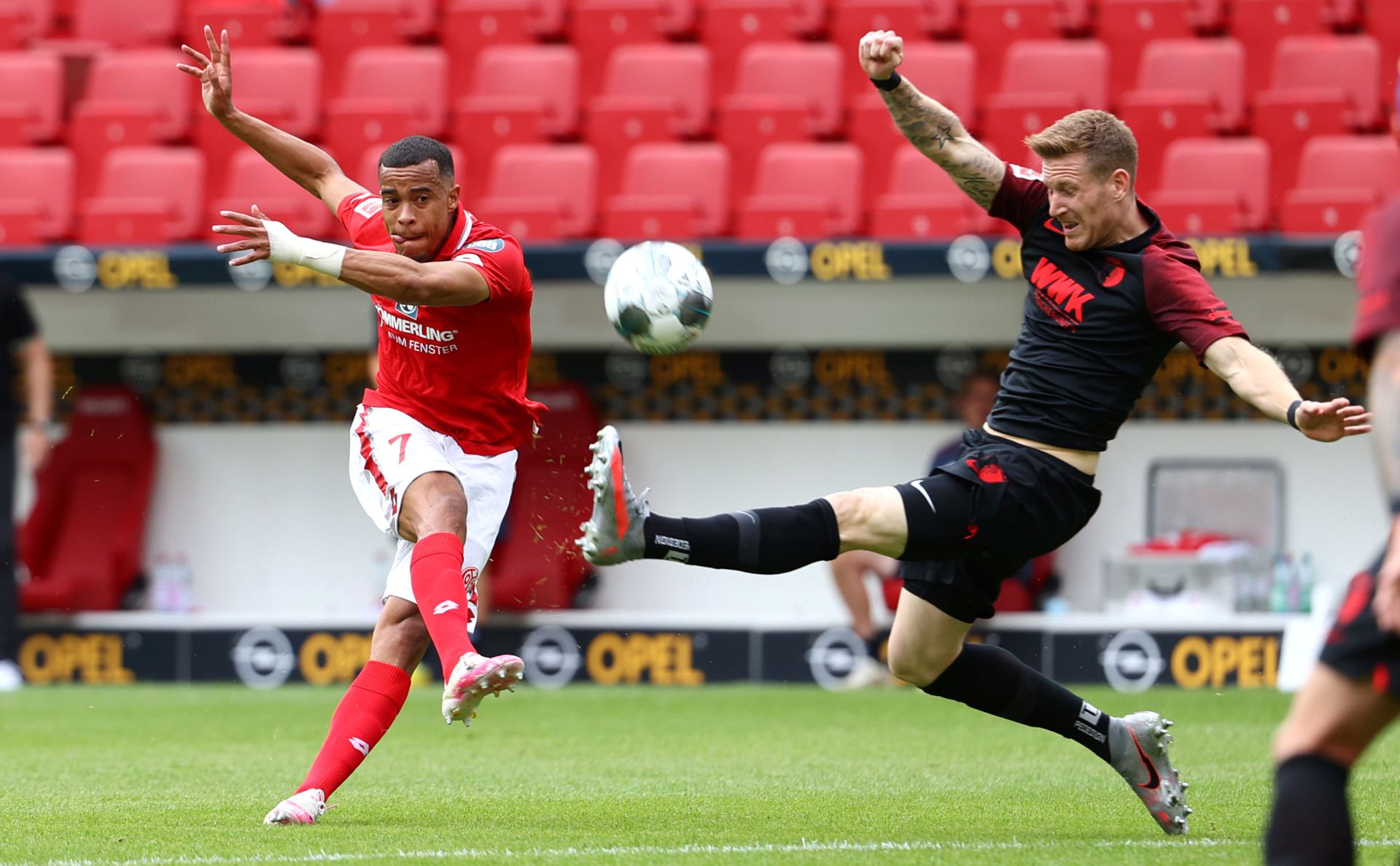 14 June 2020, Rhineland-Palatinate, Mainz: Mainz's Robin Quaison shoots on goal during the German Bundesliga soccer match between FSV Mainz 05 and FC Augsburg at the Opel Arena. Photo: Kai Pfaffenbach/reuters/Pool/dpa - IMPORTANT NOTICE: DFL and DFB regulations prohibit any use of photographs as image sequences and/or quasi-video.