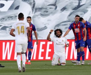 epa08485508 Real Madrid's Marcelo (C) celebrates after scoring the 3-0 lead during the Spanish LaLiga soccer match between Real Madrid and SD Eibar behind closed doors at Di Stefano stadium in Madrid, Spain, 14 June 2020.  EPA/Kiko Huesca
