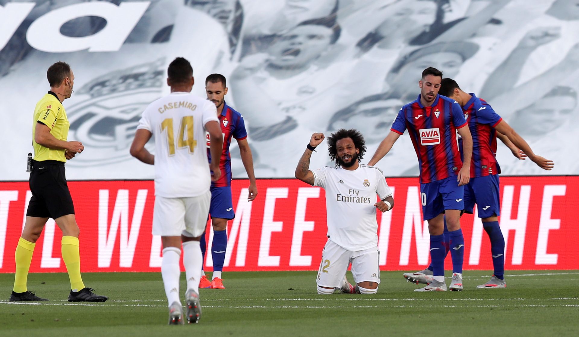 epa08485508 Real Madrid's Marcelo (C) celebrates after scoring the 3-0 lead during the Spanish LaLiga soccer match between Real Madrid and SD Eibar behind closed doors at Di Stefano stadium in Madrid, Spain, 14 June 2020.  EPA/Kiko Huesca