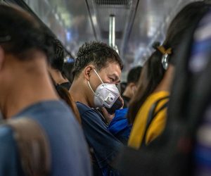 epa08493928 A man wearing a protective face mask rides the subway during an evening rush hour, in Beijing, China, 18 June 2020. Chinese health authorities said that they received reports of 28 new confirmed COVID-19 cases on 17 June of which 21 cases were reported in Beijing. Authorities gave COVID-19 nucleic acid tests to 356,000 people since 13 June, according to the city's government officials, as the number of new coronavirus cases is continuing to increase in the city.  EPA/ROMAN PILIPEY