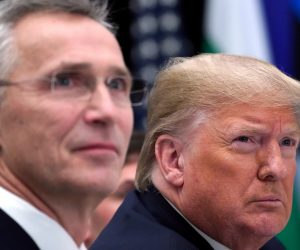FILE PHOTO: NATO Alliance summit in Watford FILE PHOTO: U.S. President Donald Trump reacts next to NATO Secretary General Jens Stoltenberg as they attend a working lunch during the NATO leaders summit in Watford, Britain, December 4, 2019. REUTERS/Kevin Lamarque/File Photo Kevin Lamarque