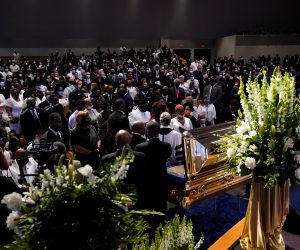 Funeral service for George Floyd at The Fountain of Praise church Family members of George Floyd pauses at the casket during a funeral service for Floyd at The Fountain of Praise church Tuesday, June 9, 2020, in Houston. David J. Phillip/Pool via REUTERS POOL