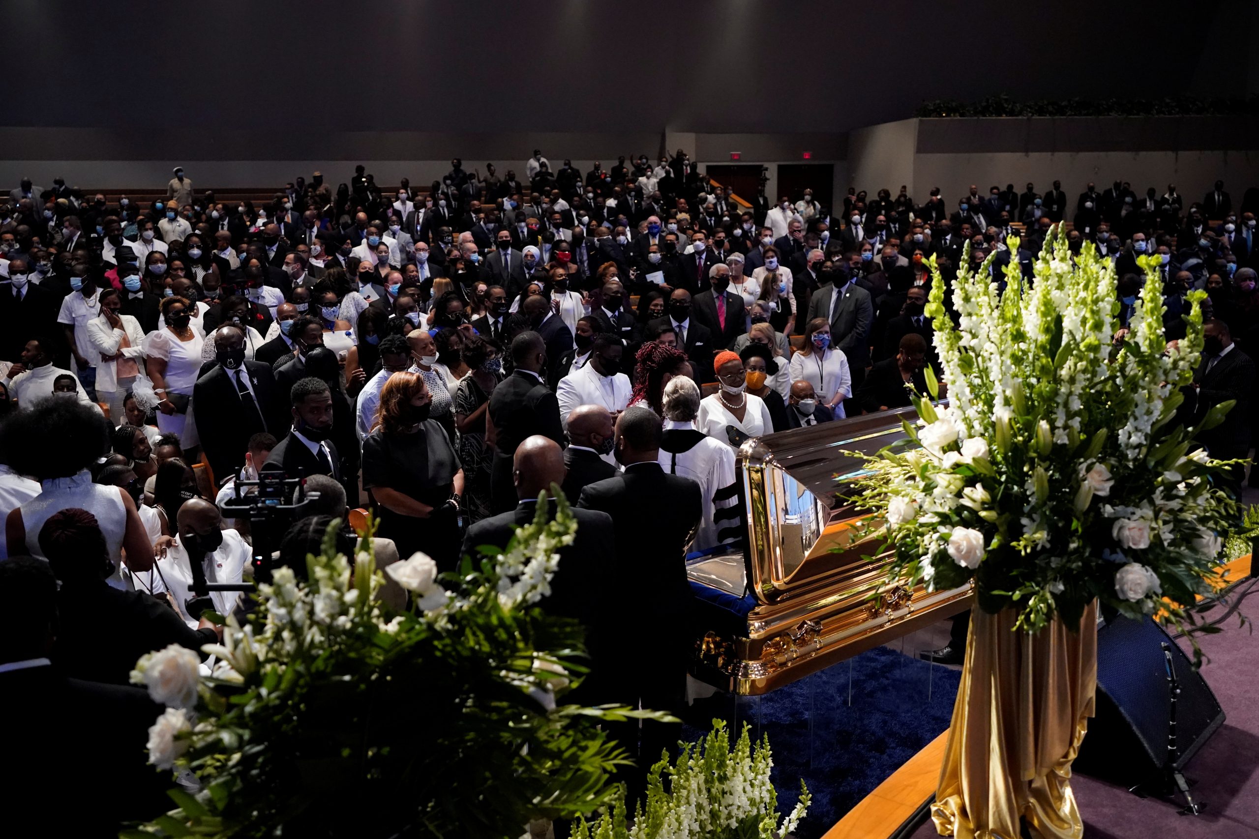 Funeral service for George Floyd at The Fountain of Praise church Family members of George Floyd pauses at the casket during a funeral service for Floyd at The Fountain of Praise church Tuesday, June 9, 2020, in Houston. David J. Phillip/Pool via REUTERS POOL