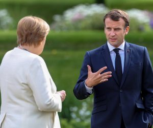 epa08516201 German Chancellor Angela Merkel (L) and French President Emmanuel Macron talk during a bilateral meeting at the German government's guest house Meseberg Castle in Gransee near Berlin, Germany, 29 June 2020. The meeting takes place ahead of Germany's EU Council Presidency in the second half of 2020.  EPA/HAYOUNG JEON / POOL