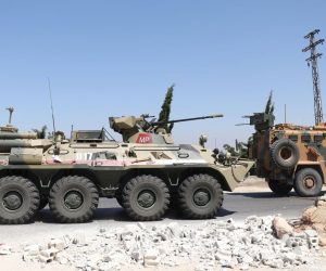 epa08520486 Tanks of the Russian-Turkish joint Military patrol No. 19 drive on the M4 road linking Tranbah village to the Town of Jisr Al-Shughour, in The outskirts of Ariha south of Idlib, Syria, 01 July 2020. The EU and the UN co-chaired, on 30 June, the fourth Brussels Conference to seek a political solution to the Syria conflict, raise financial support for Syria and the countries in the region that host Syrian refugees.  EPA/YAHYA NEMAH