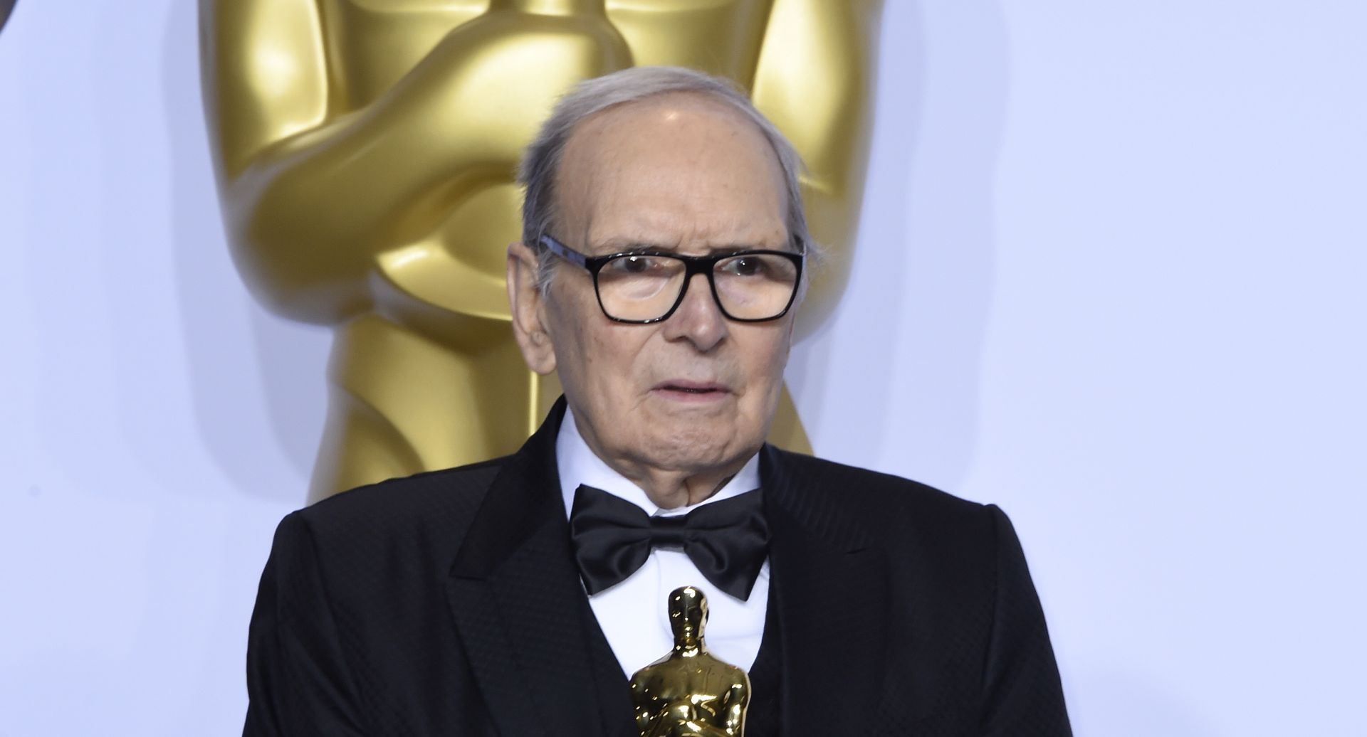 epa08530054 (FILE) - Italian composer Ennio Morricone holds the Oscar for Best Original Score for 'The Hateful Eight' in the press room during the 88th annual Academy Awards ceremony in Hollywood, California, USA, 28 February 2016 (reissued 06 July 2020). Italian composer Ennio Morricone died on 06 July 2020 at the age of 91.  EPA/PAUL BUCK