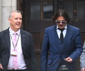 epa08532741 US actor Johnny Depp (C) leaves the Royal Courts of Justice in London, Britain, 07 July 2020. Depp is suing The Sun's newspaper publisher News Group Newspapers (NGN) over claims he abused his ex-wife, US actress Amber Heard, reports state.  EPA/FACUNDO ARRIZABALAGA