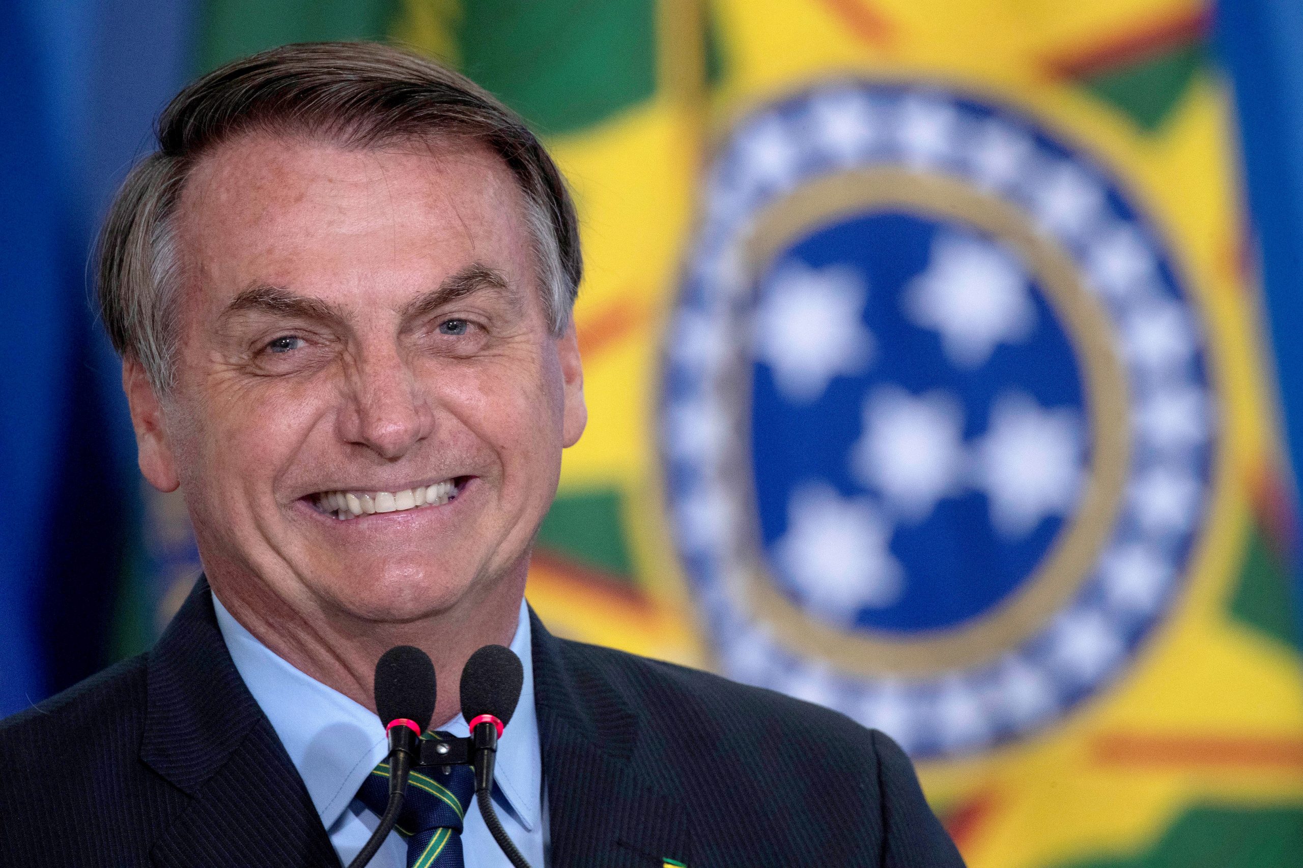 epa08532717 (FILE) - The President of Brazil Jair Bolsonaro reacts during Actress Regina Duarte, known for her roles in famous soap operas, ceremony to assume the Ministry of Culture, in Brasilia, Brazil, 04 march 2020 (reissued 07 July 2020). Bolsonaro, 65, reported on 07 July that he has tested positive for COVID-19 and has begun to be treated with chloroquine.  EPA/Joedson Alves *** Local Caption *** 55927587