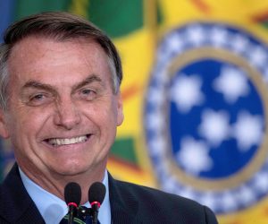 epa08532717 (FILE) - The President of Brazil Jair Bolsonaro reacts during Actress Regina Duarte, known for her roles in famous soap operas, ceremony to assume the Ministry of Culture, in Brasilia, Brazil, 04 march 2020 (reissued 07 July 2020). Bolsonaro, 65, reported on 07 July that he has tested positive for COVID-19 and has begun to be treated with chloroquine.  EPA/Joedson Alves *** Local Caption *** 55927587