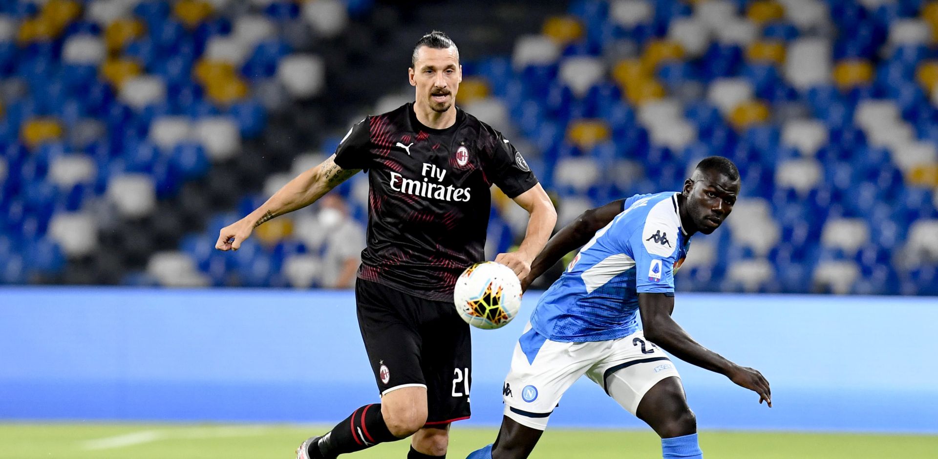 epa08542517 Milan's forward Zlatan Ibrahimovic (L) and  Napoli's defender Kalidou Koulibaly  in action during the Italian Serie A  soccer  match SSC Napoli vs  AC Milan at the San Paolo stadium in Naples, Italy, 12 July 2020.  EPA/CIRO FUSCO