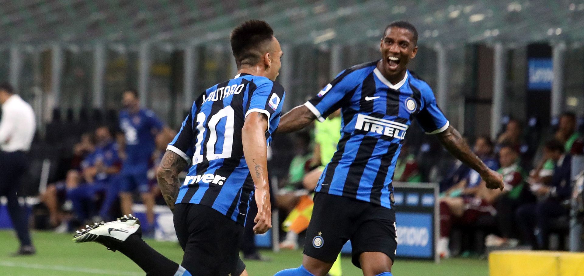epa08544264 Inter Milan's Lautaro Martinez (L) and his teammate Ashley Young celebrate the 3-1 goal  during the Italian Serie A soccer match between Inter Milan and Torino FC at Giuseppe Meazza stadium in Milan, Italy, 13 July 2020.  EPA/MATTEO BAZZI