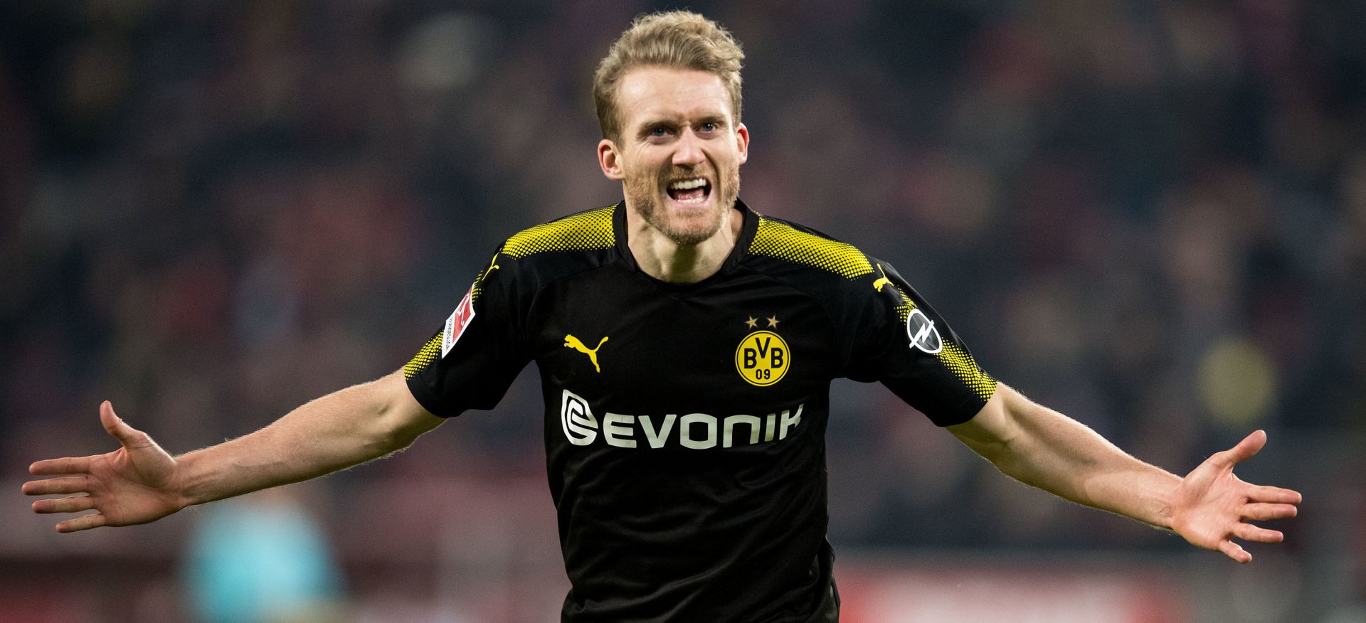 FILED - 02 February 2018, North Rhine-Westphalia, Cologne: Borussia Dortmund's Andre Schuerrle celebrates scoring his side's third goal during the German Bundesliga soccer match between 1. FC Cologne and Borussia Dortmund at the RheinEnergieStadion. German World Cup winner Andre Schuerrle has announced a surprise retirement from football aged just 29. Photo: Marius Becker/dpa