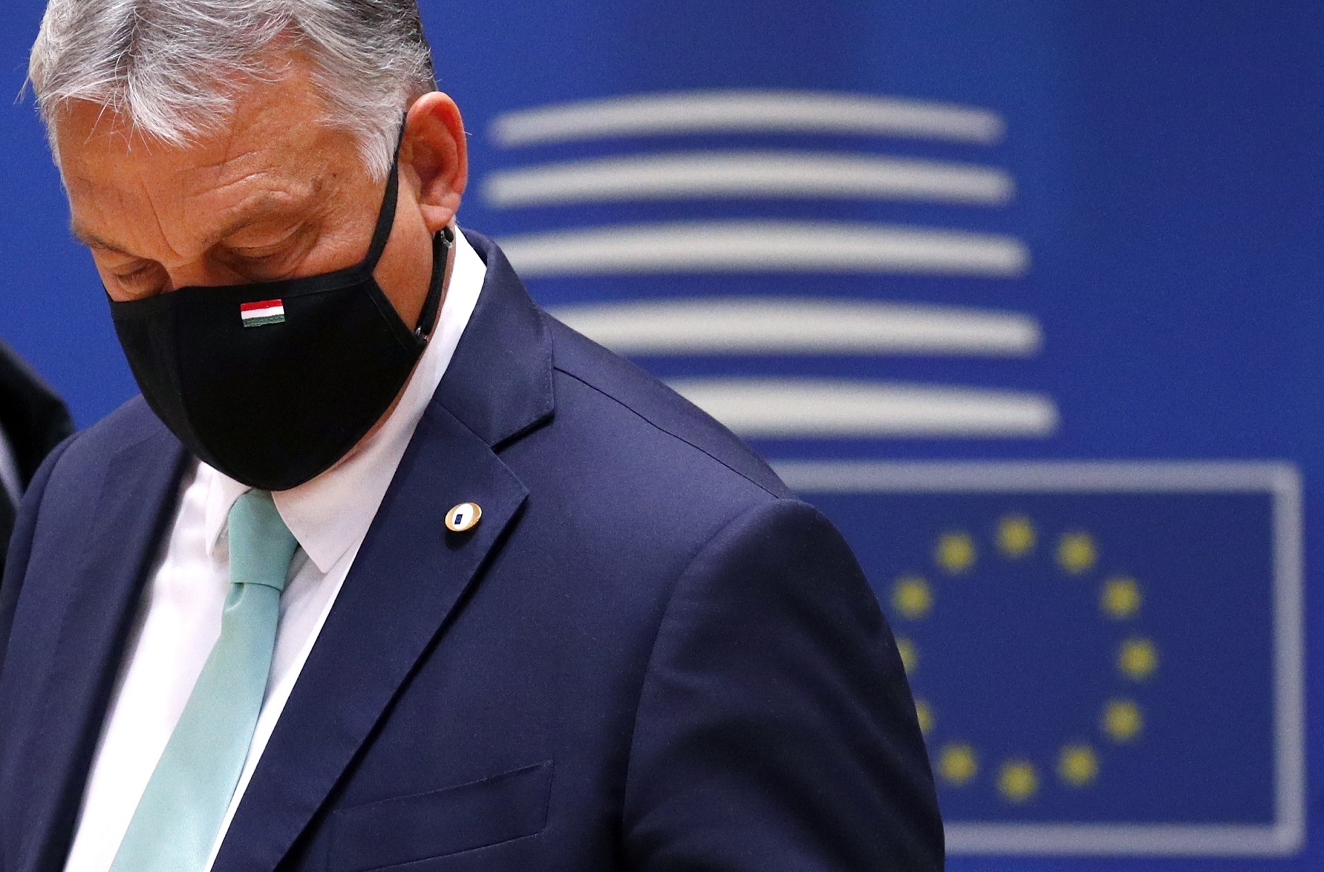 epa08553185 Hungarian Prime Minister Viktor Orban wearing a face mask at the start of the second day of an EU summit in Brussels, Belgium, 18 July 2020. European Union nations leaders meet face-to-face for the first time since February to discuss plans responding to coronavirus crisis and new long-term EU budget at the special European Council on 17 and 18 July.