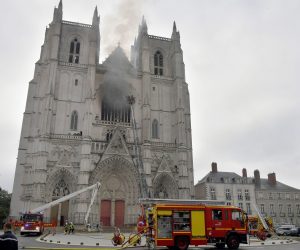 epa08553437 Fire fighters brigade work to extinguish the blaze at the Saint Peter and Saint Paul Cathedral, in Nantes, France, 18 July 2020. The blaze that broke inside the gothic cathedral of Nantes 18 has been contained, emergency officials said.   FRANCE OUT / SHUTTERSTOCK OUT