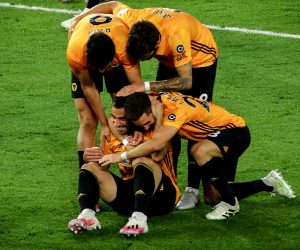 epa08557242 Wolverhampton's Jonny (bottom-L) celebrates with his teammates after scoring the 2-0 lead during the English Premier League soccer match between Wolverhampton Wanderers and Crystal Palace in Wolverhampton, Britain, 20 July 2020.  EPA/Richard Heathcote/NMC/Pool EDITORIAL USE ONLY. No use with unauthorized audio, video, data, fixture lists, club/league logos or 'live' services. Online in-match use limited to 120 images, no video emulation. No use in betting, games or single club/league/player publications.
