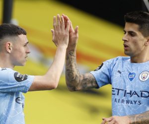 epa08559101 Phil Foden (L) of Manchester City celebrates with Joao Cancelo (R) of Manchester City  after scoring a goal during the English Premier League match between Watford and Manchester City in Watford, Britain, 21 July 2020.  EPA/John Sibley/NMC/Pool EDITORIAL USE ONLY. No use with unauthorized audio, video, data, fixture lists, club/league logos or 'live' services. Online in-match use limited to 120 images, no video emulation. No use in betting, games or single club/league/player publications.
