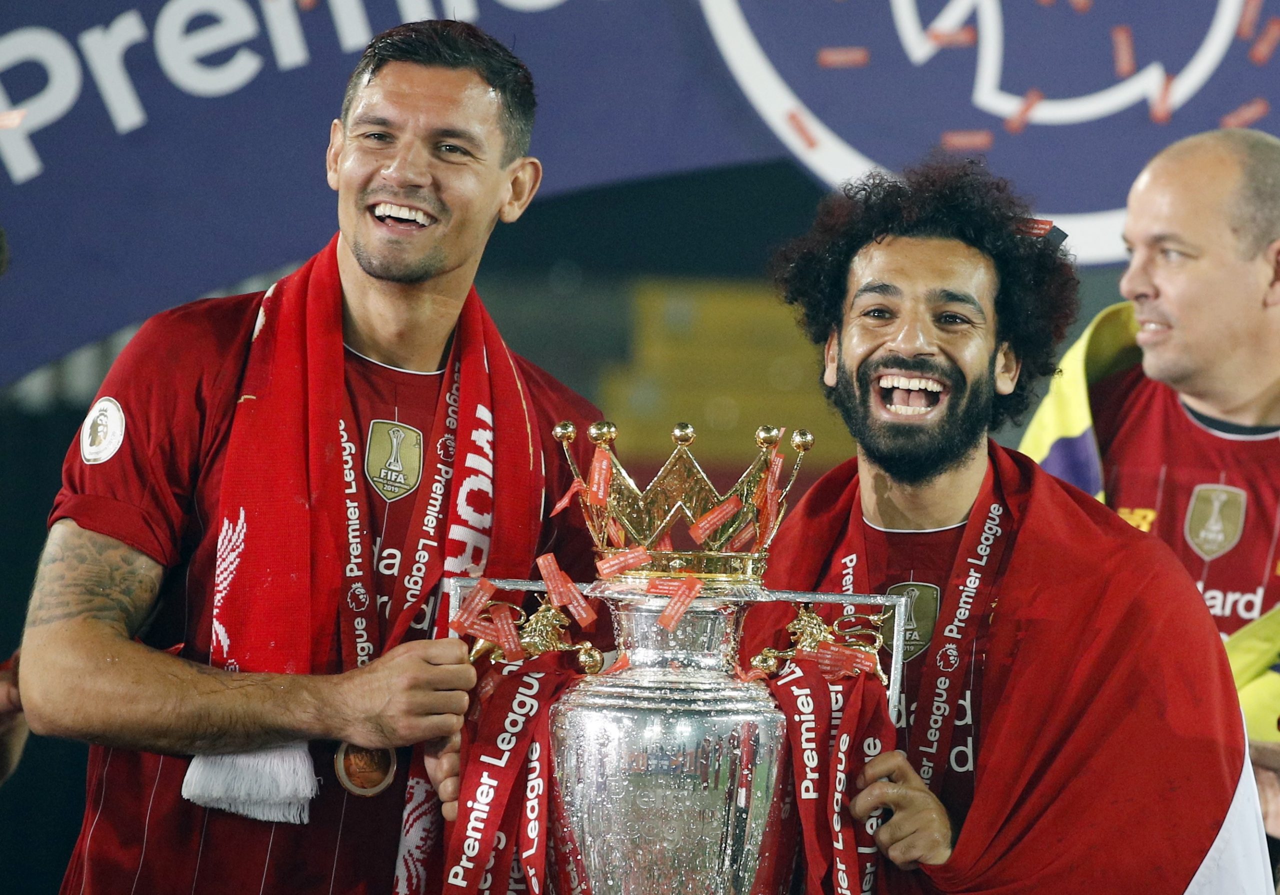 epa08562321 Liverpool's Dejan Lovren (L) and Mohamed Salah celebrate the Premier League title following the English Premier League soccer match between Liverpool FC and Chelsea FC in Liverpool, Britain, 22 July 2020.  EPA/Phil Noble/NMC/Pool EDITORIAL USE ONLY. No use with unauthorized audio, video, data, fixture lists, club/league logos or 'live' services. Online in-match use limited to 120 images, no video emulation. No use in betting, games or single club/league/player publications.