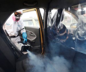 epaselect epa08573514 A worker disinfects the interior of a taxi in Bogota, Colombia, 29 July 2020. Colombia is the new focus of the pandemic in Latin America, with a high rate of infections that has already reached 10,000 daily, a situation that led the Government to extend the quarantine for another month, a measure received with skepticism by experts given the numerous exceptions in force. The country, which accumulates more than 267,000 infections, completes a month with daily figures of more than 7,000 cases, statistics focused mainly on Bogotá and Medellin.  EPA/Carlos Ortega