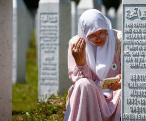 Bosnia and Herzegovina commemorates 25th anniversary of Srebrenica massacre, in Potocari A woman prays at a graveyard, ahead of a mass funeral in Potocari near Srebrenica, Bosnia and Herzegovina July 11, 2020. Bosnia marks the 25th anniversary of the massacre of more than 8,000 Bosnian Muslim men and boys, with many relatives unable to attend due to the coronavirus disease (COVID-19) outbreak. REUTERS/Dado Ruvic DADO RUVIC