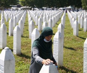 Bosnia and Herzegovina commemorates 25th anniversary of Srebrenica massacre, in Potocari A woman is seen at a graveyard, ahead of a mass funeral in Potocari near Srebrenica, Bosnia and Herzegovina July 11, 2020. Bosnia marks the 25th anniversary of the massacre of more than 8,000 Bosnian Muslim men and boys, with many relatives unable to attend due to the coronavirus disease (COVID-19) outbreak. REUTERS/Dado Ruvic DADO RUVIC
