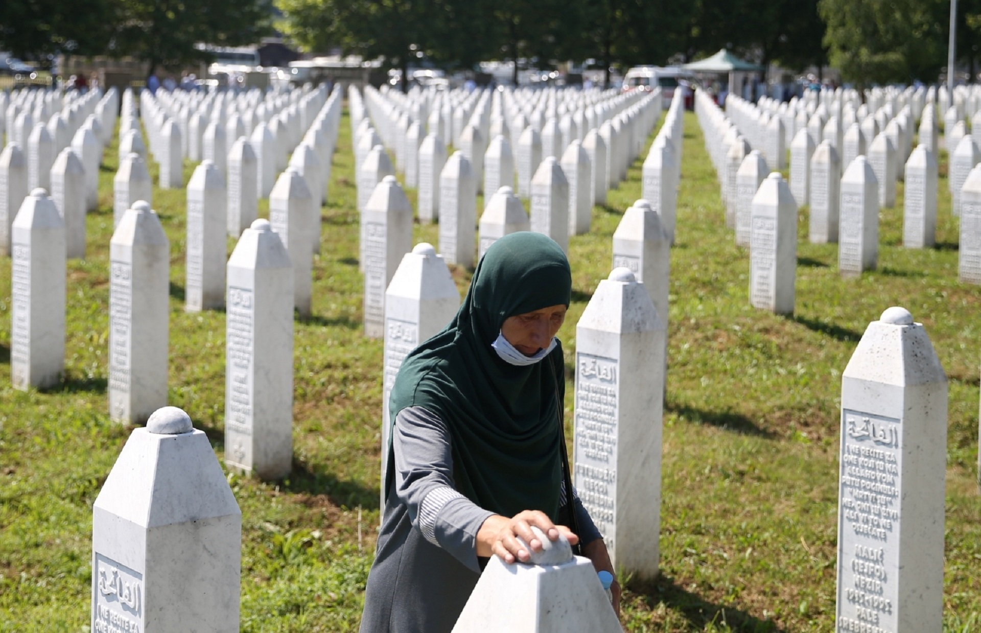 Bosnia and Herzegovina commemorates 25th anniversary of Srebrenica massacre, in Potocari A woman is seen at a graveyard, ahead of a mass funeral in Potocari near Srebrenica, Bosnia and Herzegovina July 11, 2020. Bosnia marks the 25th anniversary of the massacre of more than 8,000 Bosnian Muslim men and boys, with many relatives unable to attend due to the coronavirus disease (COVID-19) outbreak. REUTERS/Dado Ruvic DADO RUVIC