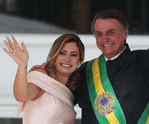 epa08574807 (FILE) - President of Brazil, Jair Bolsonaro, hugs his wife Michelle de Paula Firmo (L), during his presidential inauguration ceremony in Brasilia, Brazil, 01 January 2019 (reissued 30 July 2020). The Brazilian first lady, 38, has tested positive for COVID-19, an illness from which Bolsonaro recovered last weekend, official sources reported on 30 July 2020.  EPA/MARCELO SAYAO