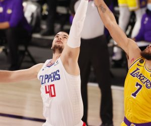 epa08575666 Los Angeles Clippers Ivica Zubac (L) and Los Angeles Lakers JaVale McGee (R) at the opening tip-off during their game at the ESPN Wide World of Sports complex restarting the NBA season in Kissimmee, Florida, USA, 30 July 2020. The NBA season is resuming with 22 teams playing all games at the Walt Disney World sports complex outside Orlando, Florida.  EPA/ERIK S. LESSER SHUTTERSTOCK OUT