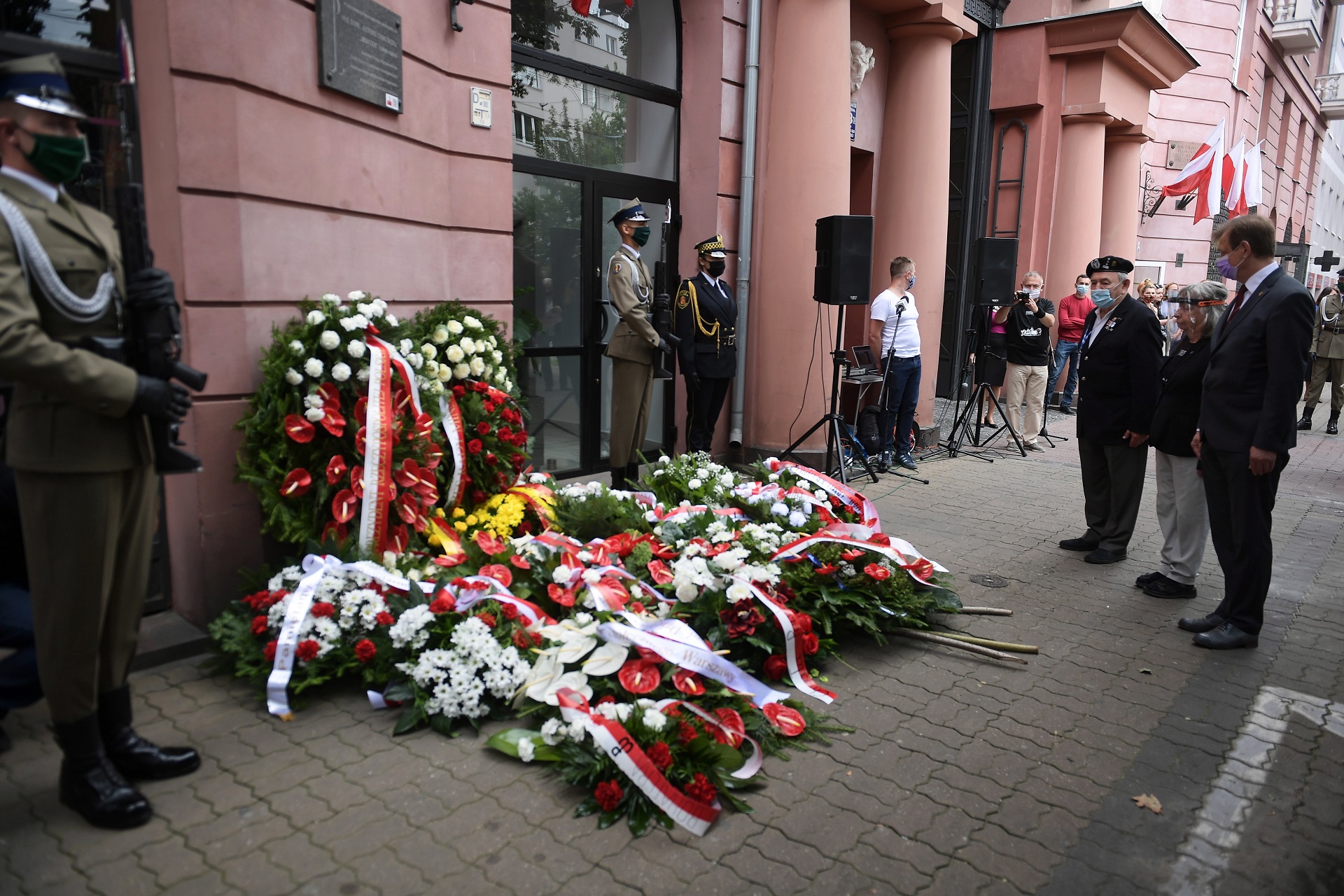 epa08578254 Authorities attend a wreath-laying ceremony at the plaque commemorating the signing of the order to start the Warsaw Uprising, at Filtrowa street in Warsaw, Poland, 01 August 2020. The ceremony was held on the occasion of the 76th anniversary of the Warsaw Uprising which started on 01 August 1944 as the biggest resistance operation in Nazi-occupied Europe. Initially intended to last several days, it continued for over two months before being suppressed by the Germans. The uprising claimed the lives of about 18,000 insurgents and around 180,000 civilians. After the uprising failed, the Nazis expelled the remaining inhabitants from the city and methodically blew it up, destroying it almost completely.  EPA/MARCIN OBARA POLAND OUT