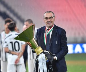 epa08579920 Juventus' head coach Maurizio Sarri celebrates with the trophy the victory of the 9th consecutive Italian championship after the Italian Serie A soccer match Juventus FC vs AS Roma at the Allianz stadium in Turin, Italy, 01 August 2020.  EPA/ALESSANDRO DI MARCO