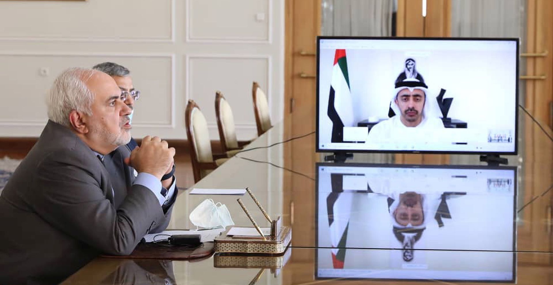 epa08580873 A handout picture made available by the Iranian foreign ministry office shows Iranian foreign minister Mohammad Javad Zarif talks to his UAE counterpart Sheikh Abdullah bin Zayed Al Nahyan (R-on the screen) during a video meeting from Tehran, Iran, 02 August 2020.  EPA/IRAN FOREIGN MINISTRY OFFICE /HANDOUT  HANDOUT EDITORIAL USE ONLY/NO SALES