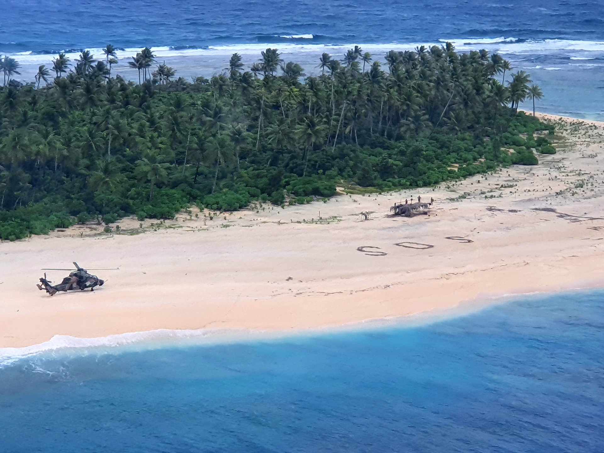 epa08582829 A handout photo made available by the Australian Department of Defence shows an Australian Army ARH-90 Tiger Helicopter landing on Pikelot Island in the Federated States of Micronesia, 02 August 2020 (issued 04 August 2020), where three men were found safe and healthy after missing for three days. Their SOS message outlined on a beach was spotted from the air by Australian and US aircraft searching the area.  EPA/AUSTRALIAN DEFENCE FORCE HANDOUT -- MANDATORY CREDIT: COMMONWEALTH OF AUSTRALIA 2020 -- HANDOUT EDITORIAL USE ONLY/NO SALES *** Local Caption *** HMAS Canberra and its embarked aviation assets have assisted in locating the three-person crew of a skiff that had been missing for nearly three days in waters off the Federated States of Micronesia. The men were found on 2 August in good condition on Pikelot Island, 190 kilometres west of where they had set off in their 23-foot (seven-metre) skiff on 30 July. Their SOS message outlined on a beach was spotted from the air by Australian and US aircraft searching the area. 

The Australian Defence Force had been asked for search and rescue support by the Rescue and Coordination Centre (RCC) in Guam on the afternoon of 1 August 2020. 

A US Air Force KC-135 aircraft located a rudimentary SOS sign on the beach, which queued HMAS Canberra and her embarked helicopters to locate the missing sailors. A US Coast Guard C-130 aircraft also assisted in the search, providing supplies and communications through an air drop.